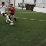 Boys playing indoor Soccer