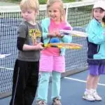 facility apex tennis center kids balancing balls on racquets