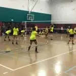 girls playing volleyball at Simms the Street Recreation Center