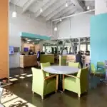 A room with a table and chairs.