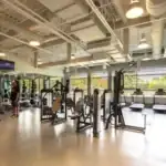 A gym with several exercise equipment.
