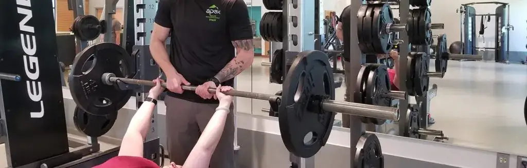 A person lifting a barbell.