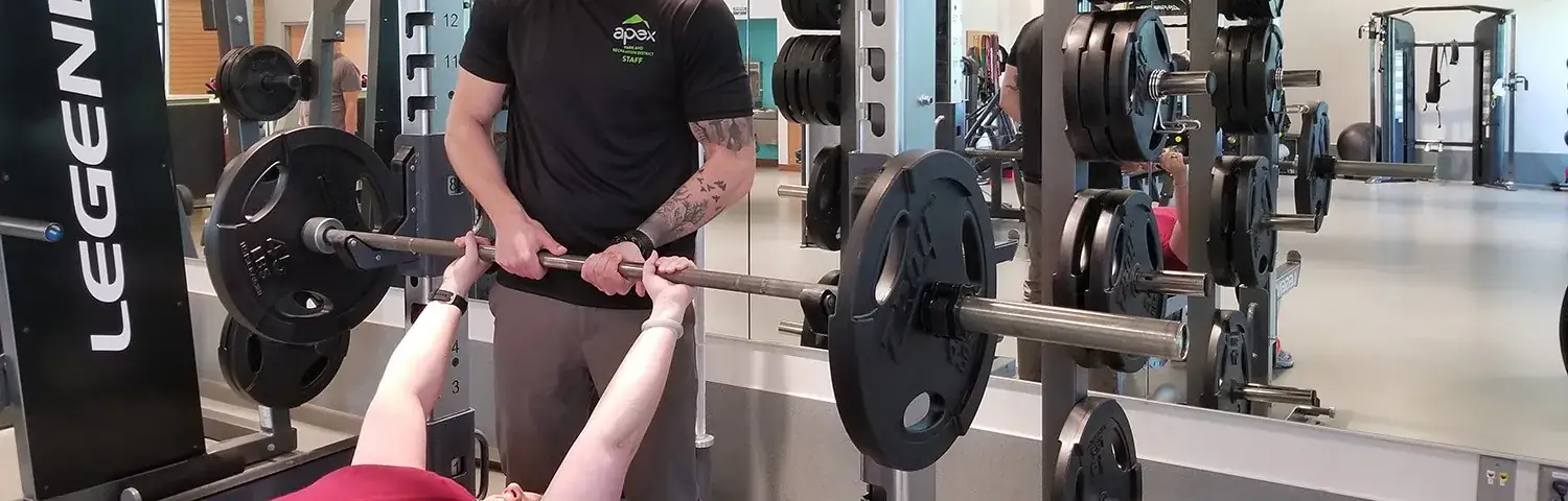 A person lifting a barbell.