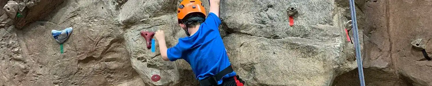 boy Rock Climbing indoors