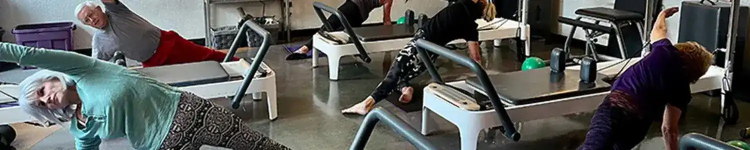 A group of people working out in a gym