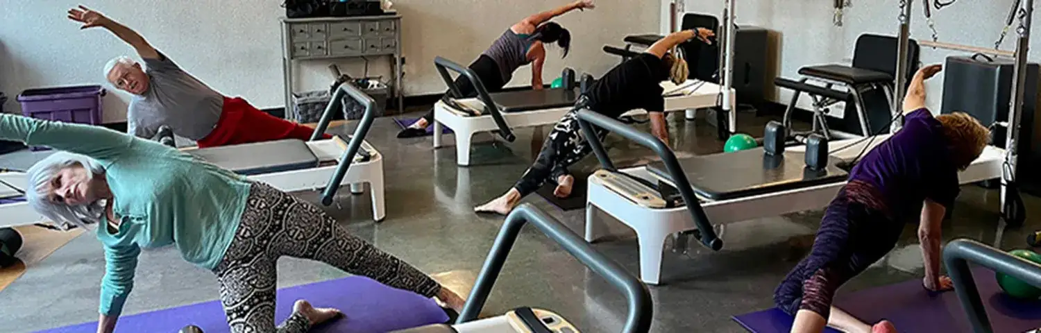 A group of people working out in a gym.