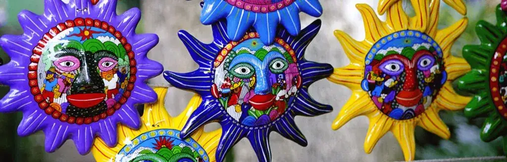 A group of colorful masks hanging from a line