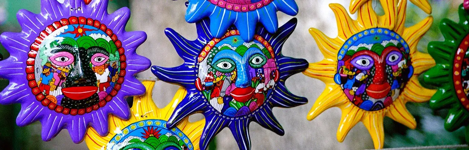 A group of colorful masks hanging from a line